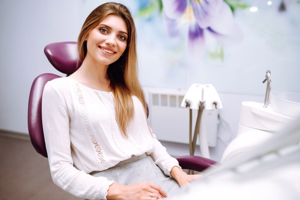 Beautiful woman patient at the dentist's chair. Overview of dental caries prevention. Healthy Smile.